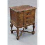 A carved oak dwarf chest, fitted three long drawers & on bulbous turned legs & ball feet with X-