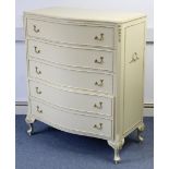 A continental-style cream & gilt finish serpentine-front chest, fitted five long graduated drawers