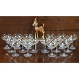 A Babycham advertising figure & sixteen Babycham glasses