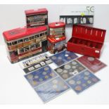 Various GB pre-decimal coin sets & other coins; four novelty tins in the form of buses & trams; &
