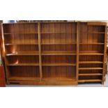 A large bespoke-made Welsh oak standing corner bookcase, in three sections, each fitted six