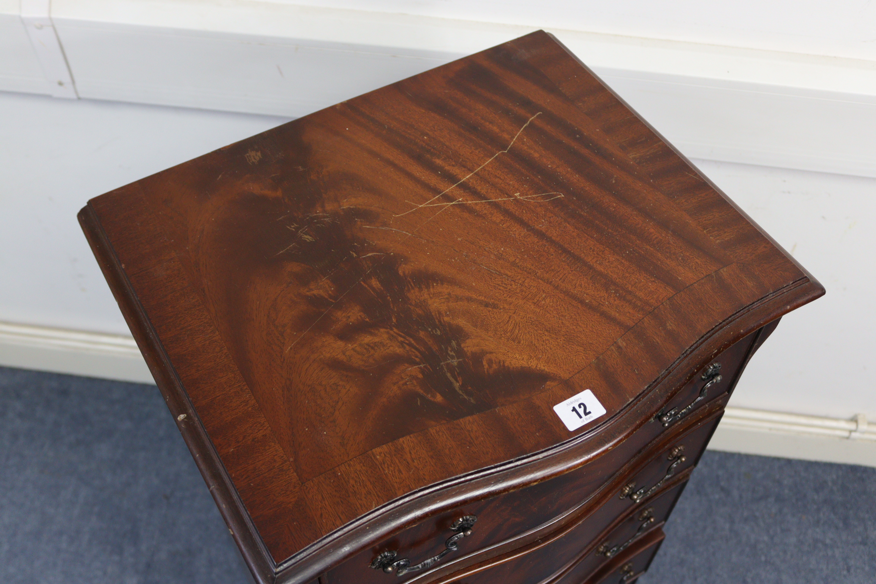 A reproduction mahogany small upright serpentine-front chest, fitted six long drawers with cast- - Image 3 of 3