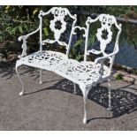 A Victorian-style white painted aluminium two-seater bench, 39” long.