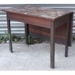 A late 19th century mahogany drop-leaf side table on square chamfered legs, 36” wide.