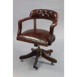 A matching brass-studded & buttoned-back swivel desk chair, on five splay legs with castors.