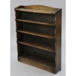 An oak standing five-tier open bookcase with shaped end supports, 36” wide x 45” high.