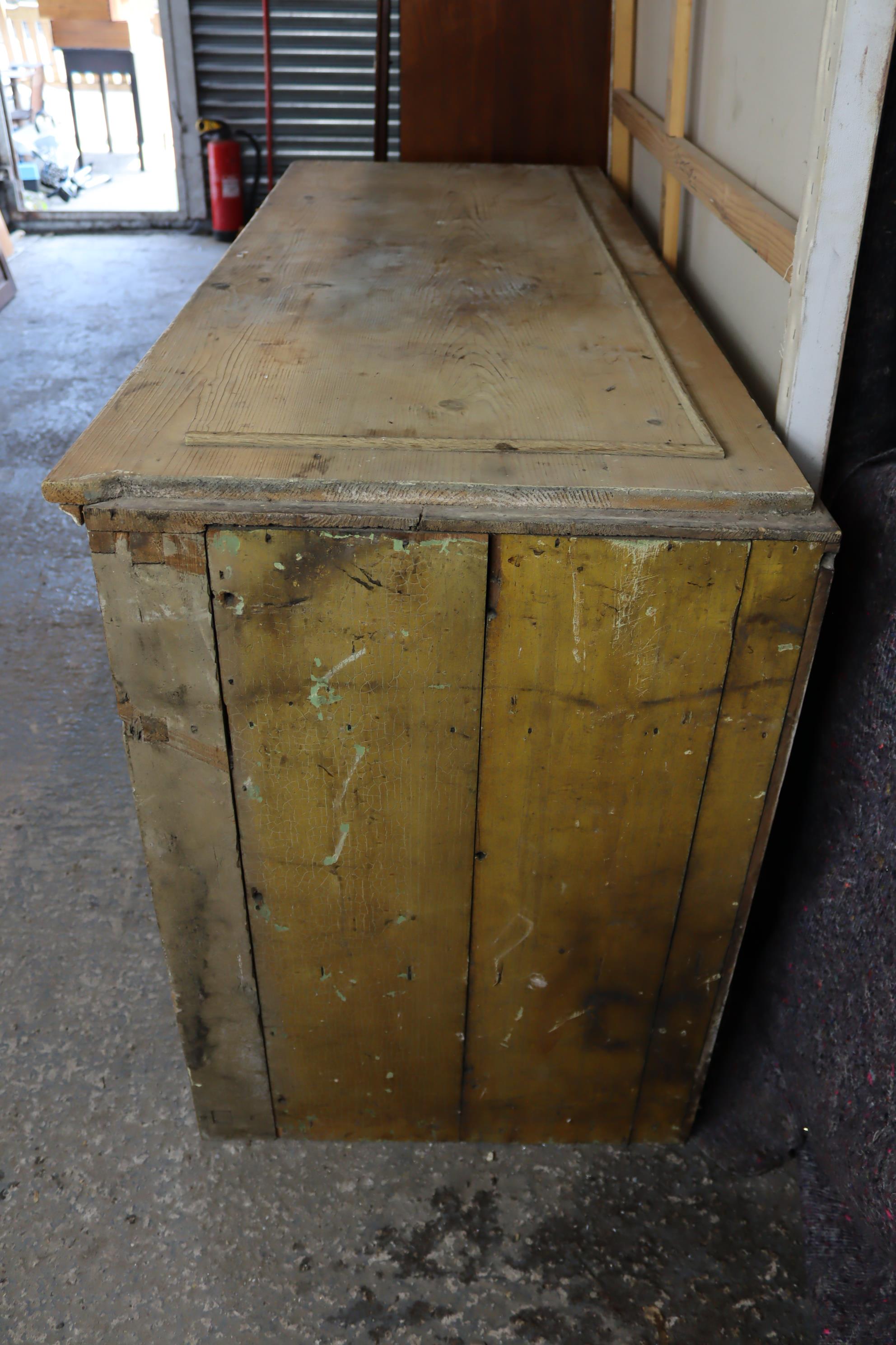 A pine dresser base, fitted three frieze drawers above cupboard enclosed by pair of sliding panel - Image 5 of 5