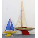 Two painted wooden pond yachts, each with sails; & a painted wooden model speedboat, 31¾” long.