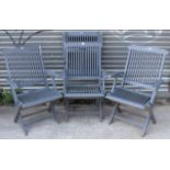A set of four grey painted teak fold-away garden chairs.