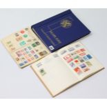 An album & contents of Dutch stamps; two small albums & contents of G.B. & foreign stamps; & a small