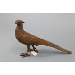 A model cast-iron pheasant garden ornament, 11” high.