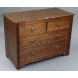 A late Victorian walnut low chest fitted two short & two long graduated drawers with brass swing