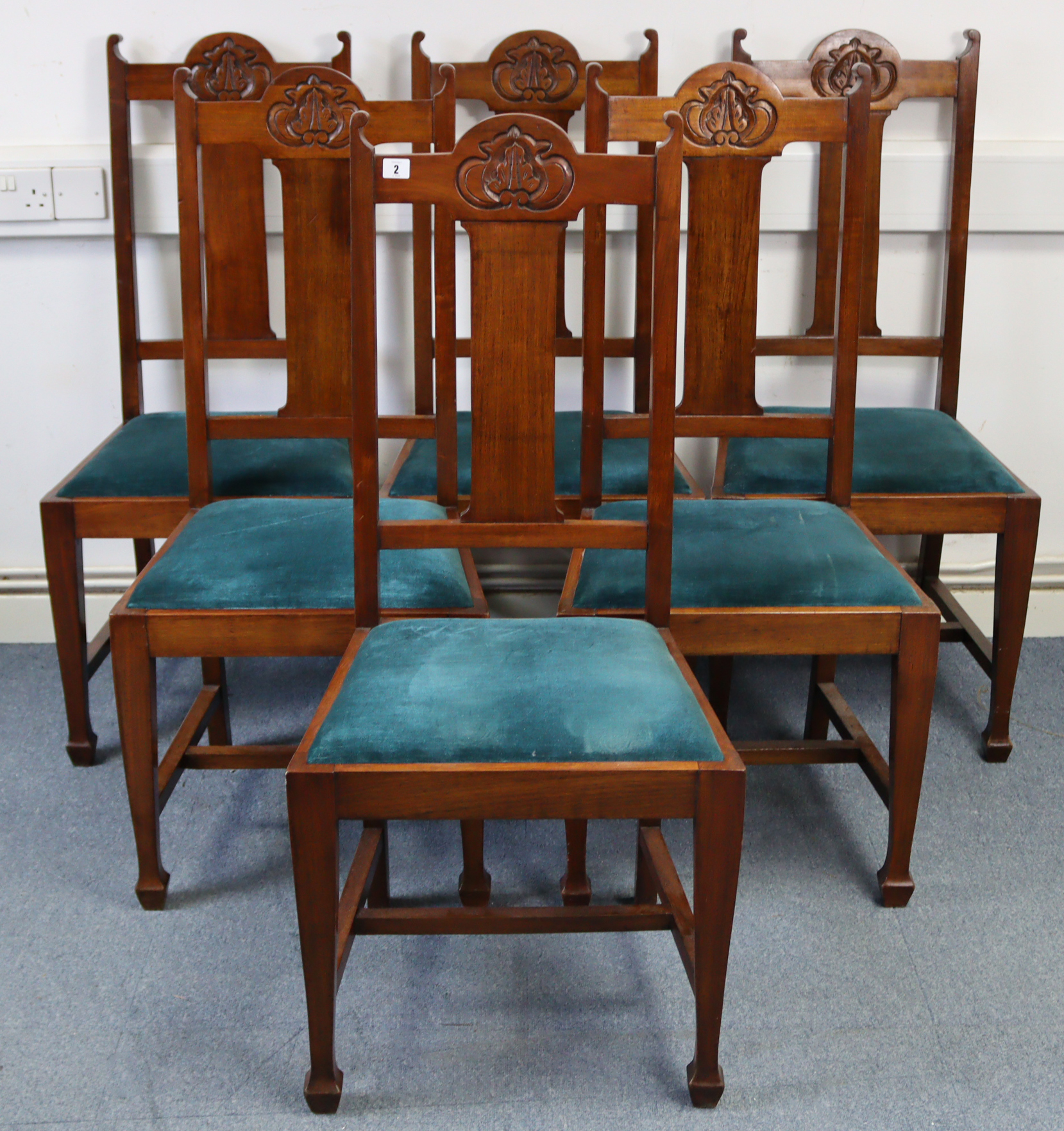 A set of six 1930’s carved walnut rail-back dining chairs with padded drop-in seats & on square