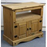 A pine dwarf cabinet, with open recess above cupboard enclosed by pair of fielded panel doors, &on