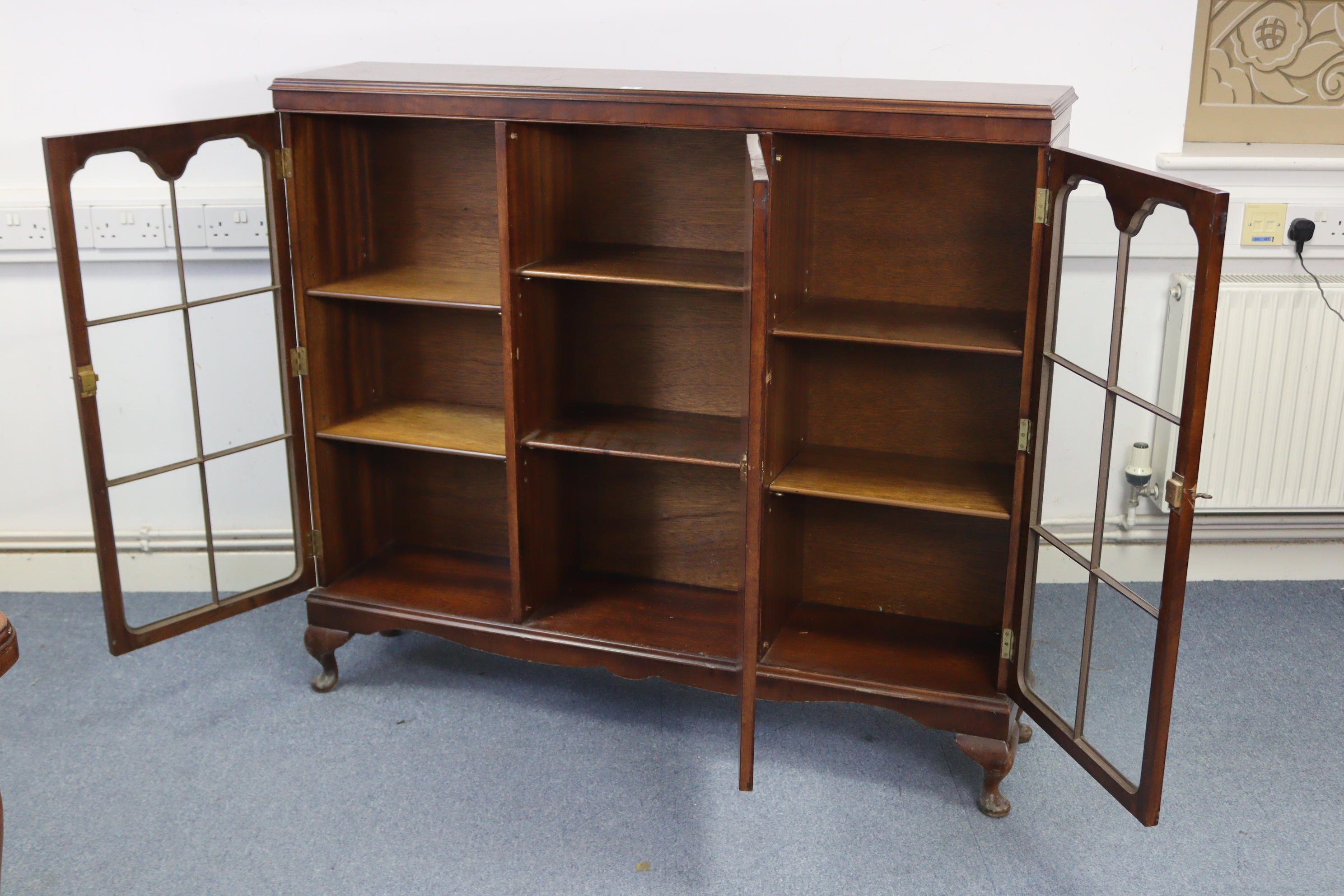 A mid-20th century walnut bookcase, with six adjustable shelves enclosed by panel door to centre - Image 2 of 3