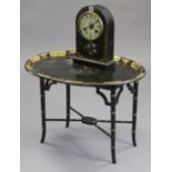 A late 19th/early 20th century mantel clock, in ebonised case with mother-of-pearl inlaid floral