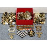 Thirty-eight various British military cap badges; together with various tunic buttons, cloth badges,