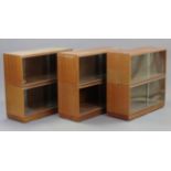 Three Simplex mahogany-finish sectional bookcases, each bookcase with two stacking tiers, each