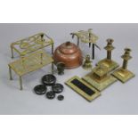 An ornate brass desk set; three trivets; & various other items of metalware.