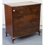 A reproduction walnut small bow-front chest, fitted brushing slide above four long graduated drawers