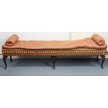A large window seat with loose cushions to the seat, &on six short cabriole legs & pad feet, 81½”