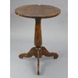 A rustic-style tripod table with circular top, & on vase-turned centre column& three cabriole