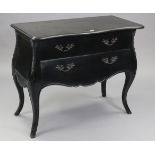 A 19th century continental-style ebonised finish bombé-shaped chest, with serpentine front marble