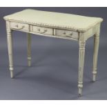 A continental-style cream-finish wooden serpentine-front side table fitted three frieze drawers, &