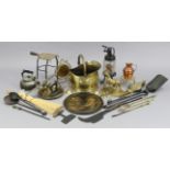 A brass helmet-shaped coal scuttle; a brass trivet; a pair of brass candlesticks; & various other