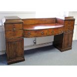 A Regency mahogany pedestal sideboard fitted two frieze drawers to the “well” centre, drawers &