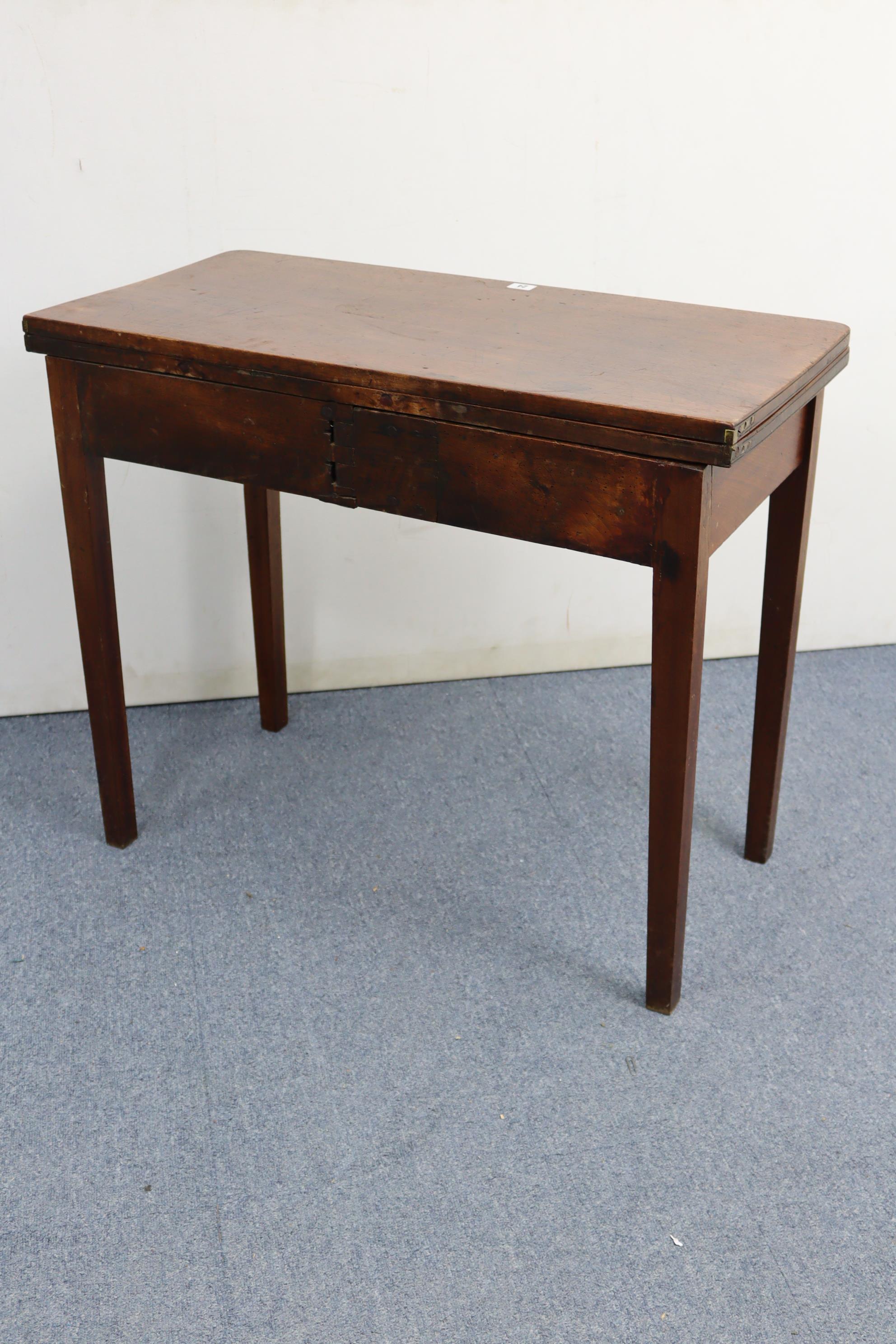 A 19th century mahogany tea table with rectangular fold-over top, fitted frieze drawer & on square - Image 7 of 7