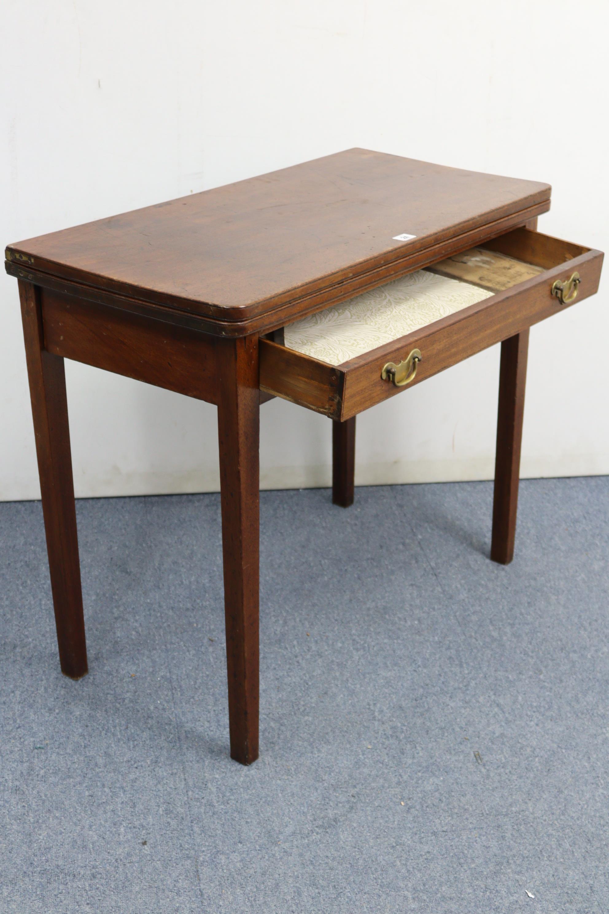 A 19th century mahogany tea table with rectangular fold-over top, fitted frieze drawer & on square - Image 4 of 7