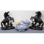 A pair of black painted aluminium Marley horse ornaments, 16” high; together with two blue &