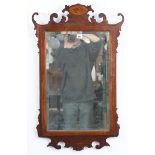 A Georgian-style rectangular wall mirror inset bevelled plate, & in inlaid-mahogany fret-carved