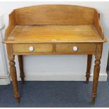 A pine tray-top side table, fitted two frieze drawers & on turned tapered legs, 36” wide.