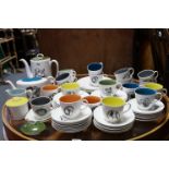 Sixty-four items of Susie Cooper “Black Fruit” pattern tea & coffee ware.