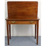 A 19th century mahogany tea table with rectangular fold-over top, fitted frieze drawer & on square