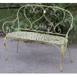 A Victorian-style cream painted wrought-iron two-seater garden bench, 47” wide.