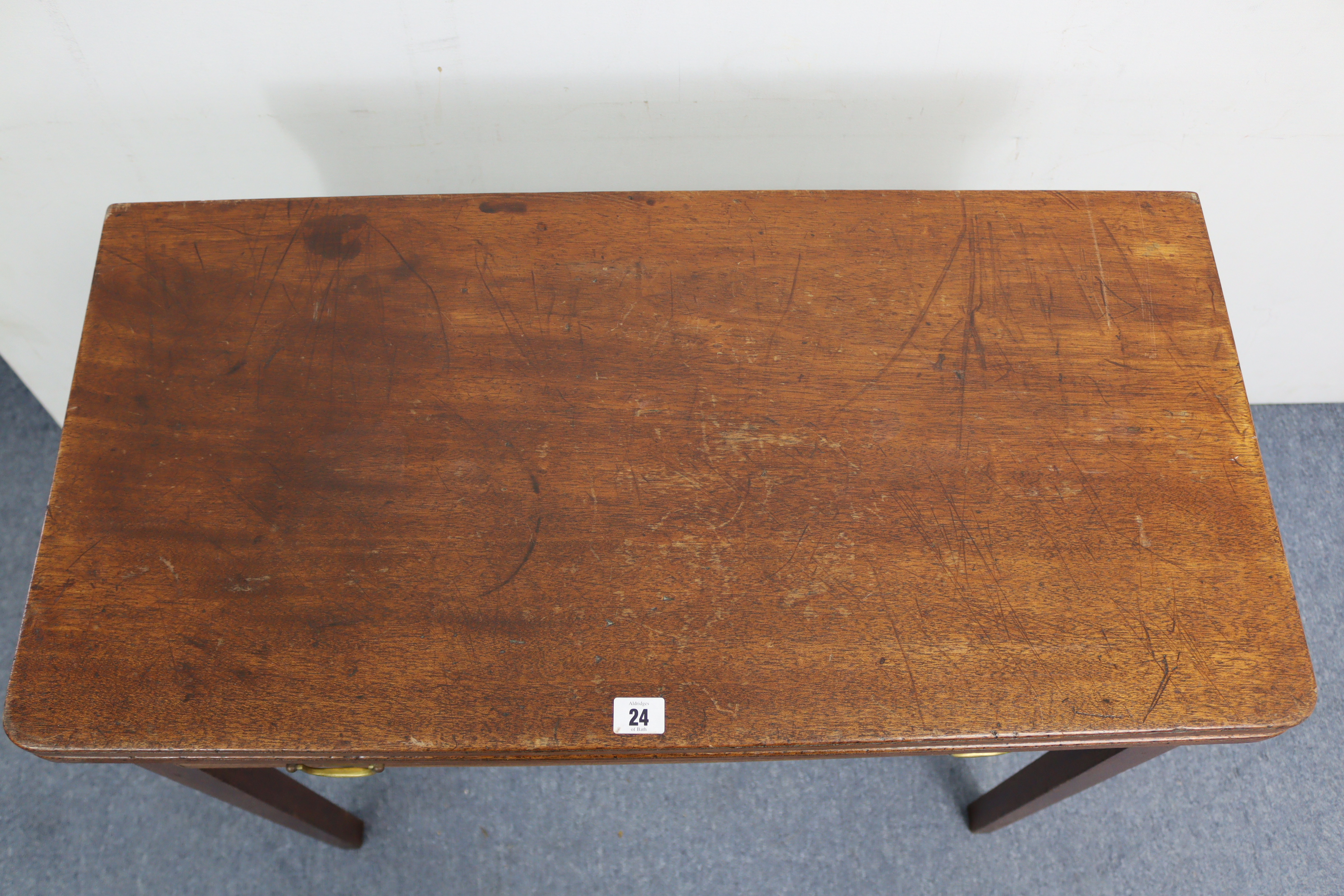 A 19th century mahogany tea table with rectangular fold-over top, fitted frieze drawer & on square - Image 3 of 7