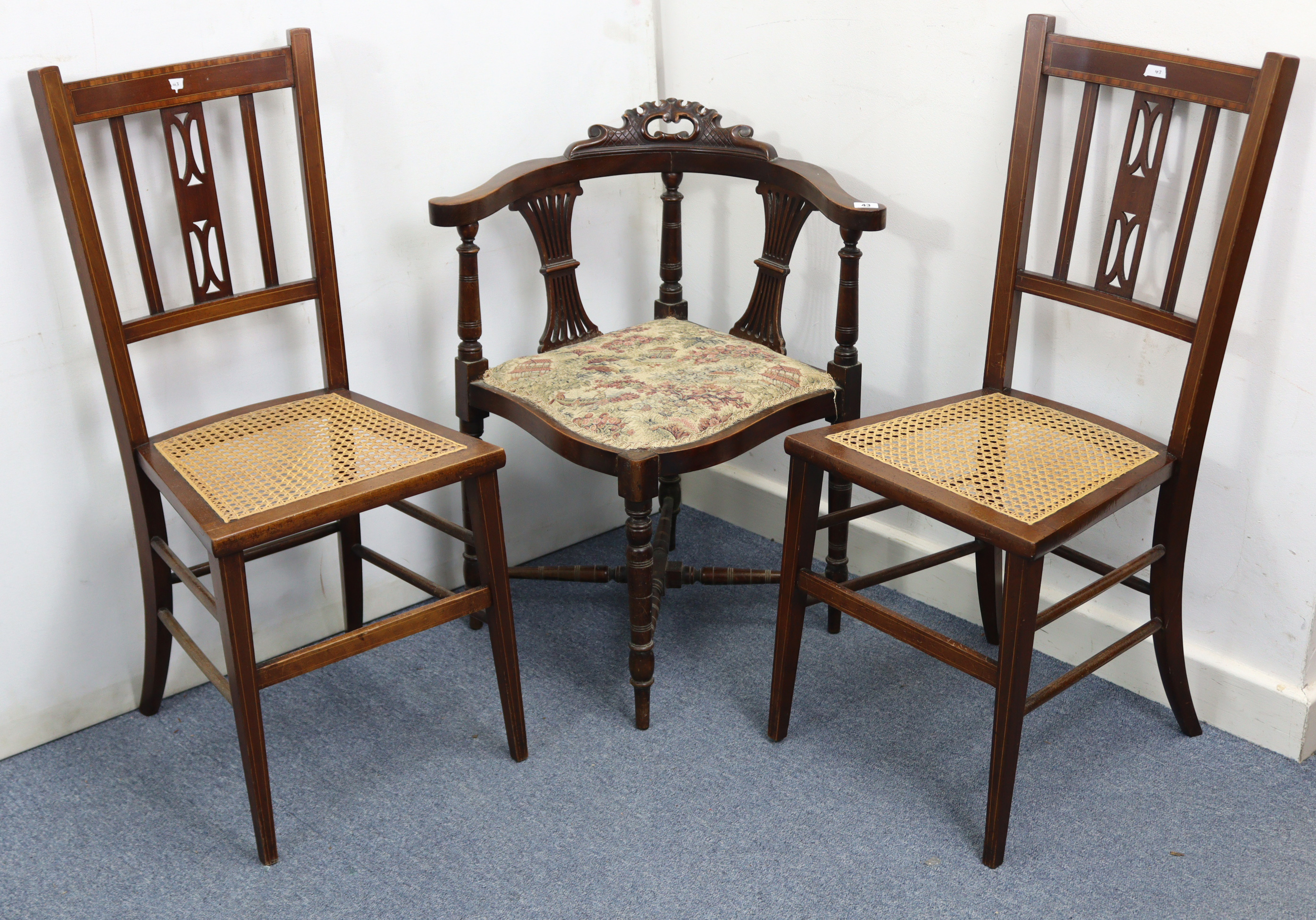 A late Victorian carved mahogany splat-back corner elbow chair with padded seat, & on ring-turned