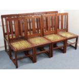 A set of eight hardwood rail-back dining chairs with strap seats, & on square legs with plain