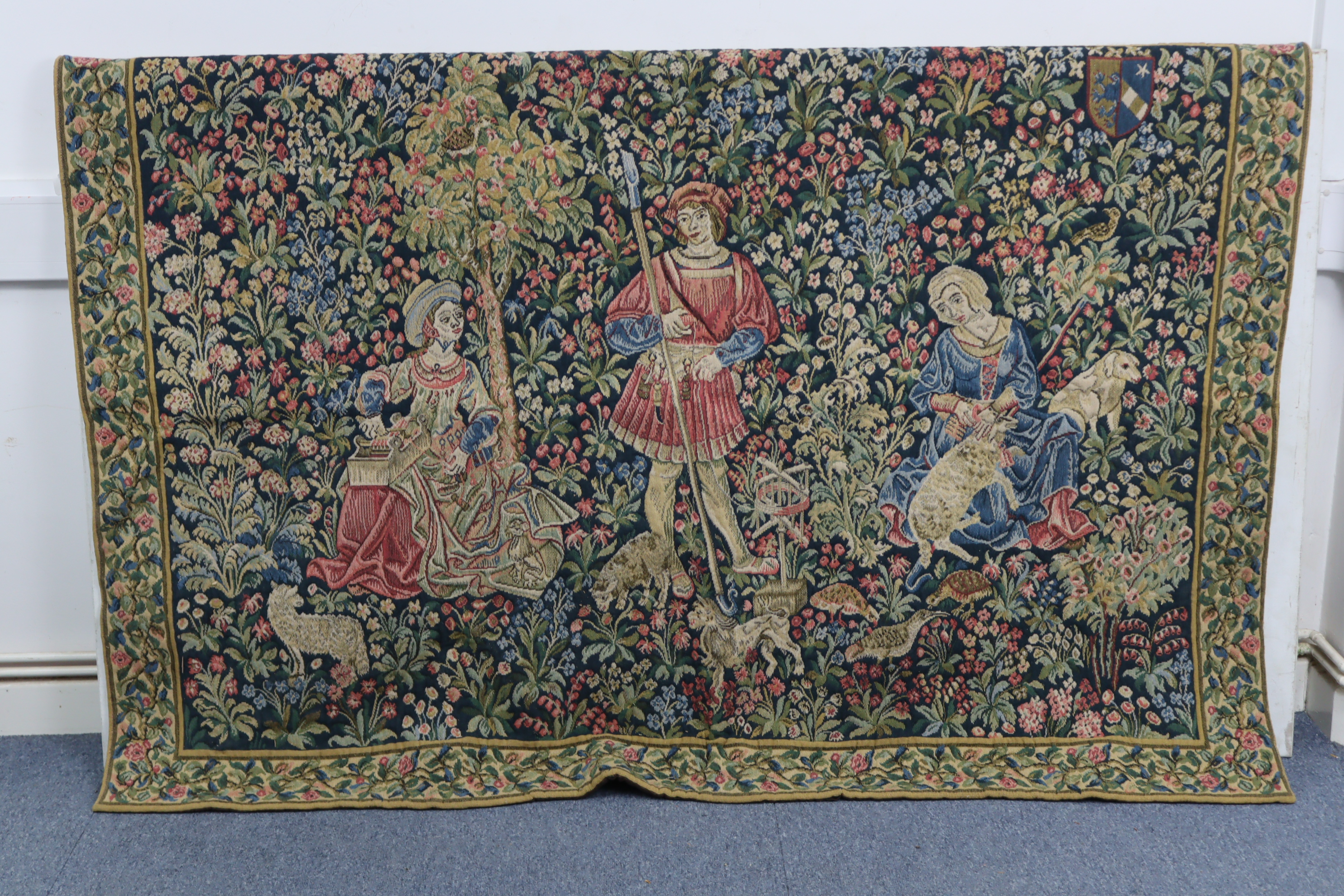 A reproduction tapestry depicting three figures in a garden scene, 70½” x 50”; together with a - Image 2 of 3