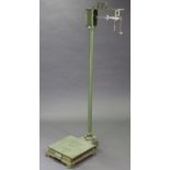 A Walter Parry & Sons of London cast-iron platform scale, to weigh 7lb, painted in green with gold