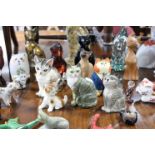 Approximately sixty various cat ornaments.