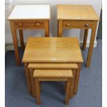 An oak nest of three rectangular occasional tables; together with two bedside tables.