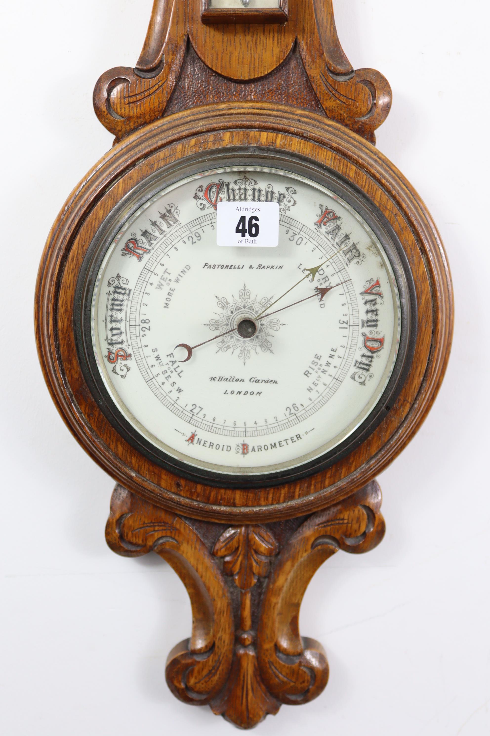 A late 19th/early 20th century aneroid wall barometer, the white enamel dial signed “Pastorelli & - Image 2 of 2