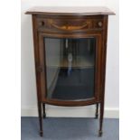 An early 20th century inlaid-mahogany small bow-front china display cabinet, fitted frieze drawer