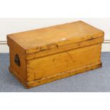 A deal storage trunk with hinged lift-lid, & wrought-iron side handles, on plinth base, 31” wide x