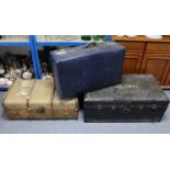 Three fibre-covered travelling trunks, each containing numerous items of household linen,