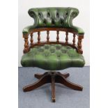 A reproduction mahogany frame swivel desk chair, with padded seat & back upholstered buttoned